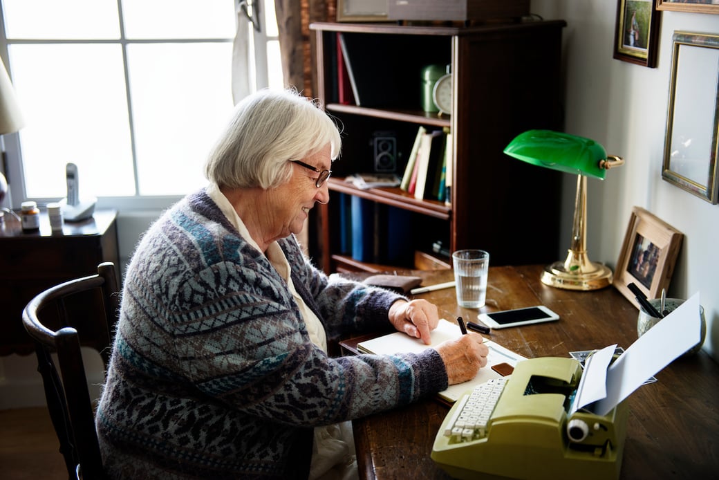 Woman writing letter to pen pal