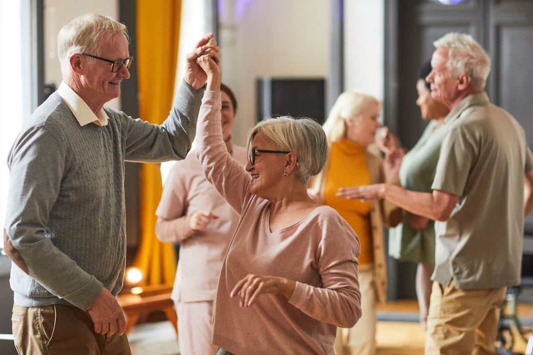 Seniors dancing in a group class