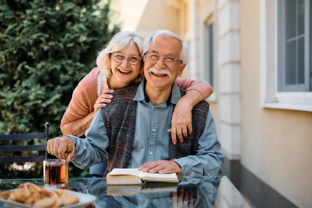 Senior couple smiling at the camera