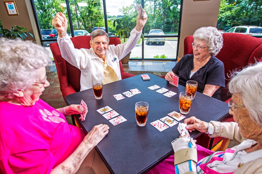 Group of seniors playing a card game