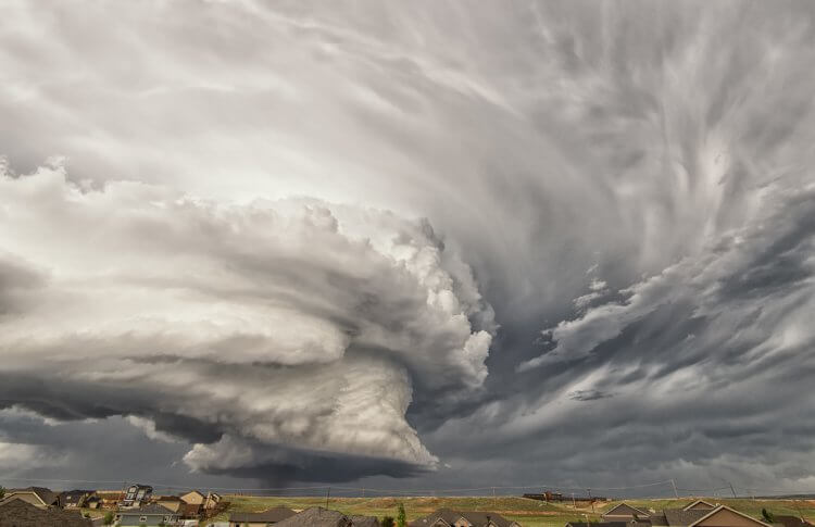 Storm clouds forming a tornado in the sky