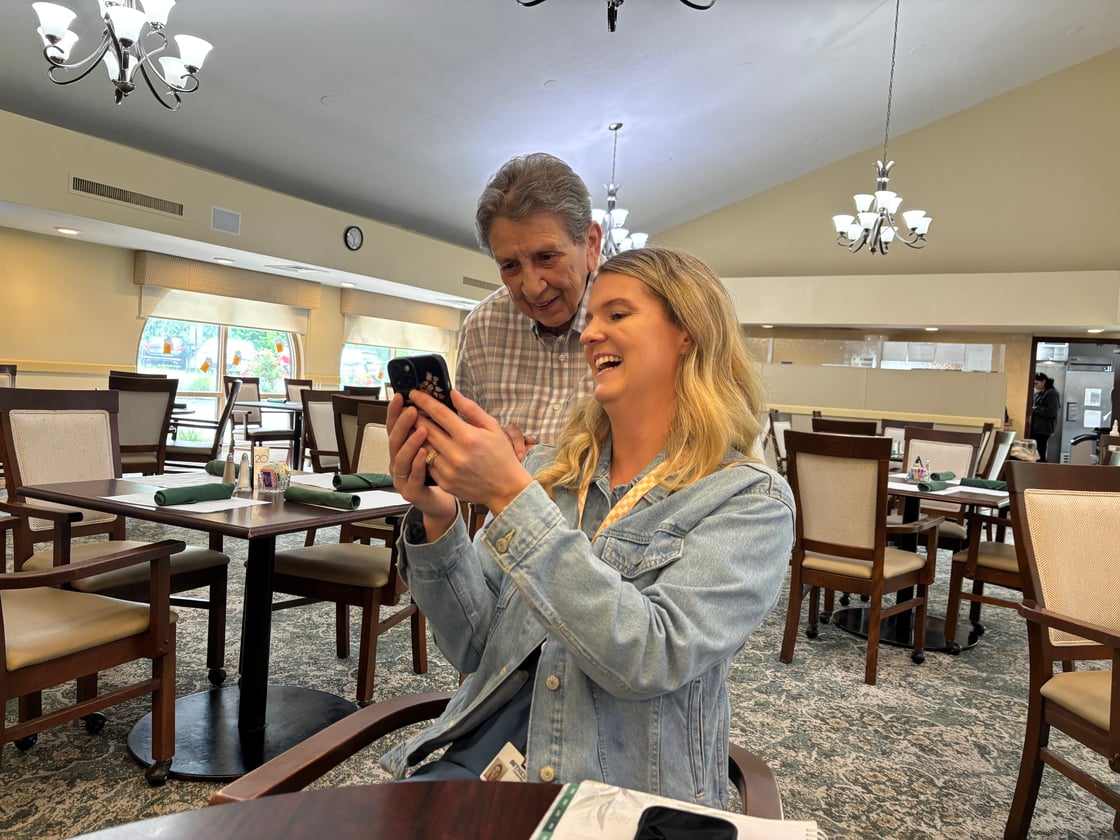 Bethesda Terrace resident, Jo, and Sales Counselor, Ashley, watching TikTok videos