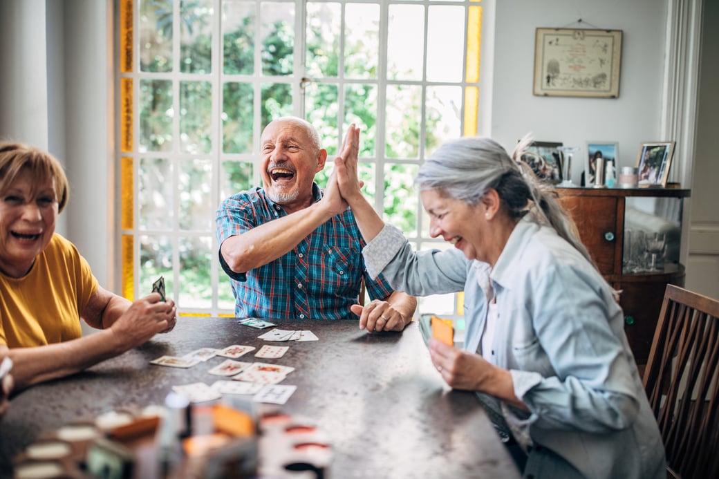 Group of seniors playing cards