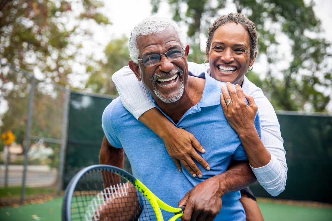 Senior couple playing tennis