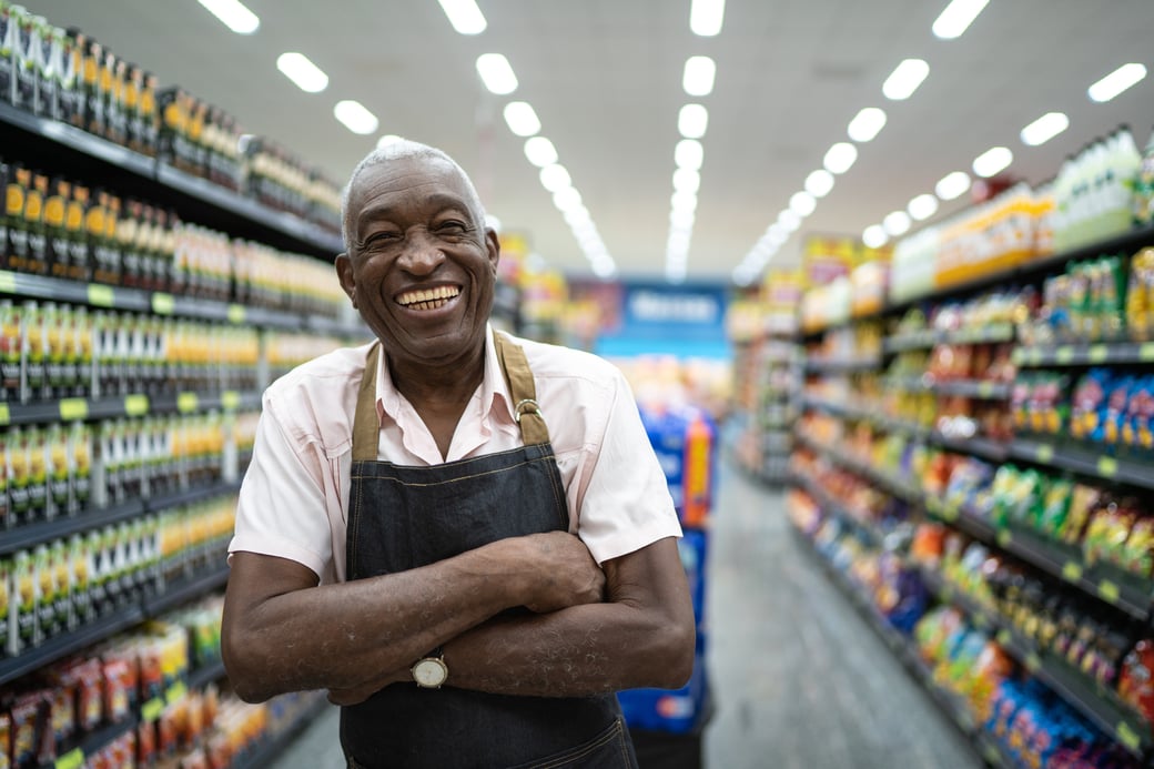 Senior man working in a grocery store