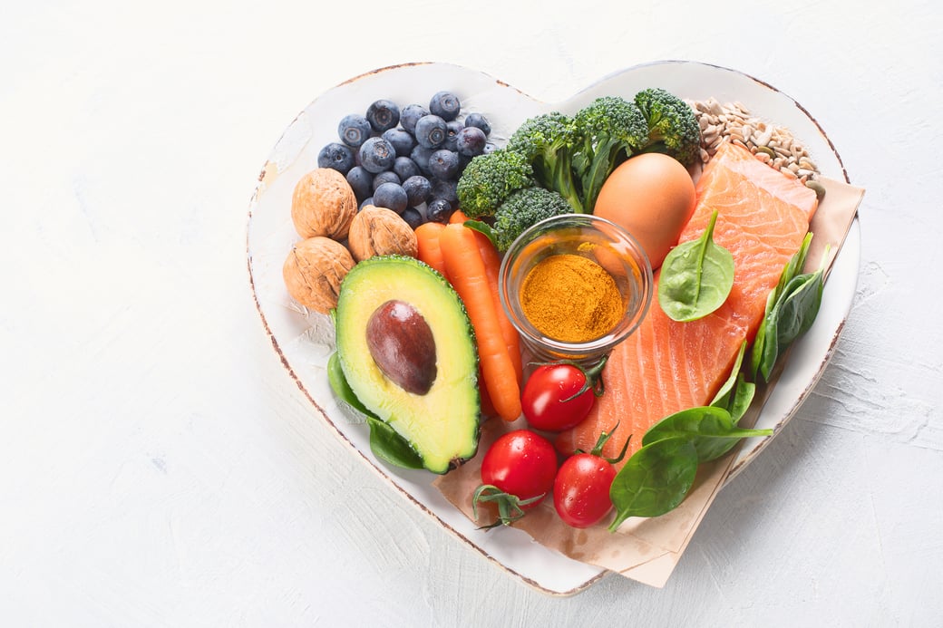 Heart-shaped bowl of healthy food choices