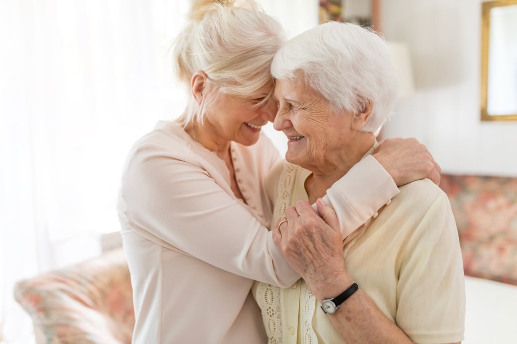 Woman Hugging Senior Mother