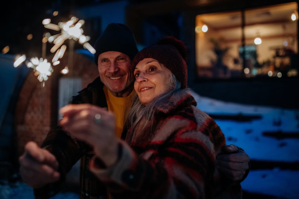 Senior couple holding sparklers