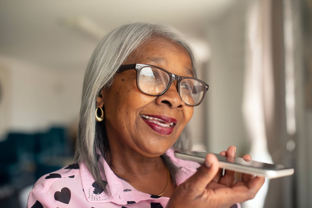 Senior woman speaking into a phone