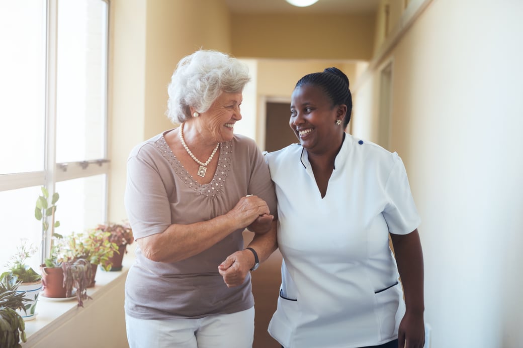 Woman walking with caregiver