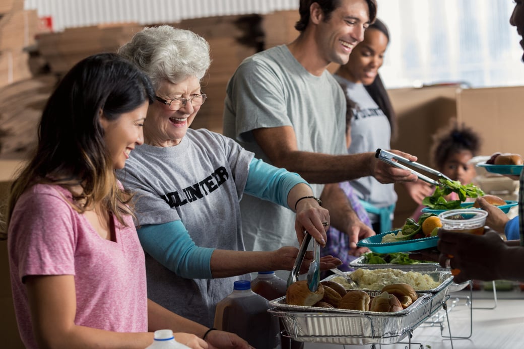 Group of volunteers serving food