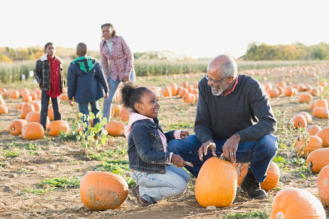 Grandparents and grandchildren in a pumpkin patch
