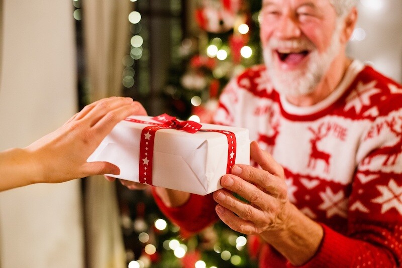 Senior man receiving holiday gift