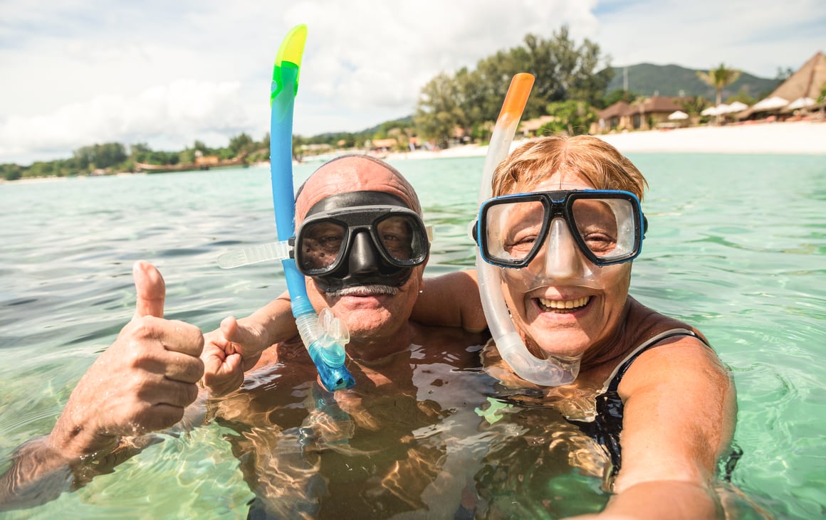 Senior couple snorkeling