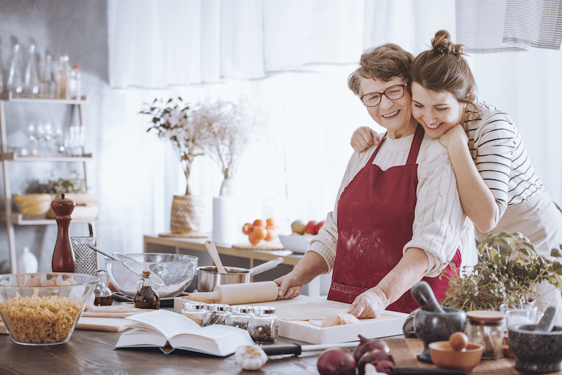 Granddaughter baking with grandmother