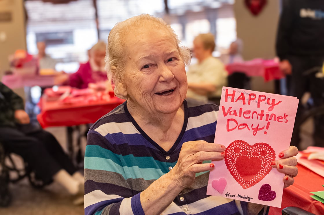 Bethesda Southgate resident holding up handmade Valentine's Day card