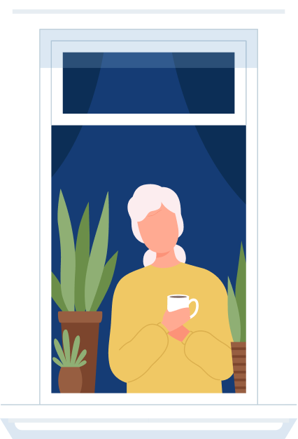 Woman sitting by the window with a coffee in her hands